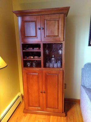 Custom built maple liquor cabinet featured in a Brandywine finish for a customer in North Arlington, NJ