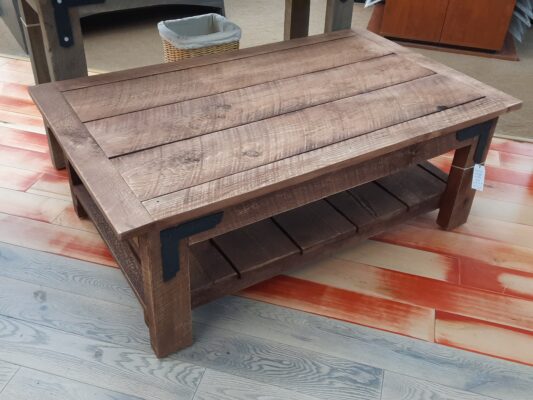 Solid Rough-Sawn Pine Coffee Table featured in a Brick hand-rubbed finish