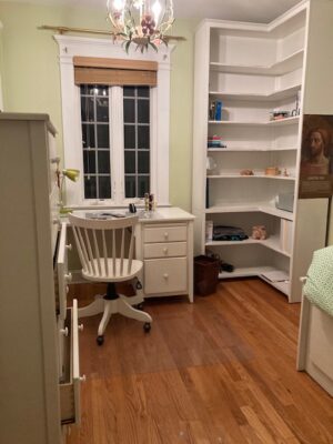 A Shaker style corner bookcase with matching desk and chest featured in white lacquer for a convent in Bronxsville, NY.